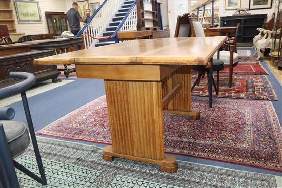 An Art Deco 1920s oak extending dining table L.137cm